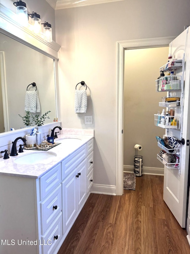 4 Bayou Ln, Natchez, MS 39120 - bathroom with double vanity, wood finished floors, baseboards, and a sink