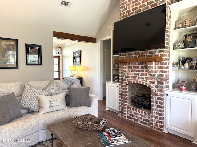 4 Bayou Ln, Natchez, MS 39120 - living area with visible vents, a fireplace, lofted ceiling, and dark wood-style flooring