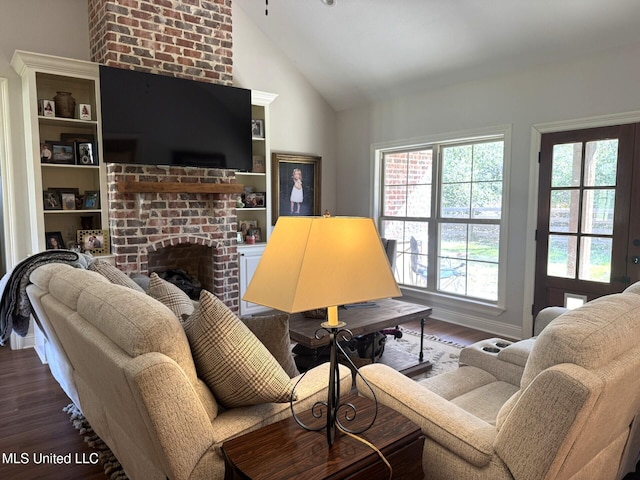 4 Bayou Ln, Natchez, MS 39120 - living area with baseboards, high vaulted ceiling, a brick fireplace, and wood finished floors
