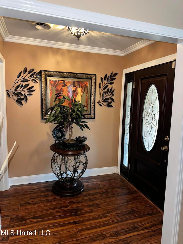 foyer with dark hardwood / wood-style flooring and ornamental molding