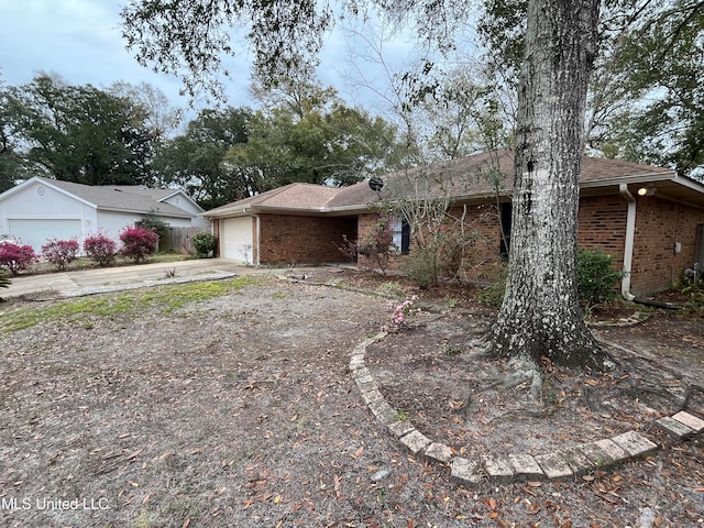 ranch-style house featuring a garage