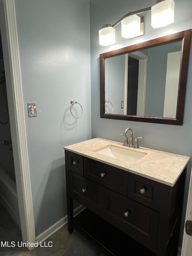 bathroom with vanity and tile patterned flooring