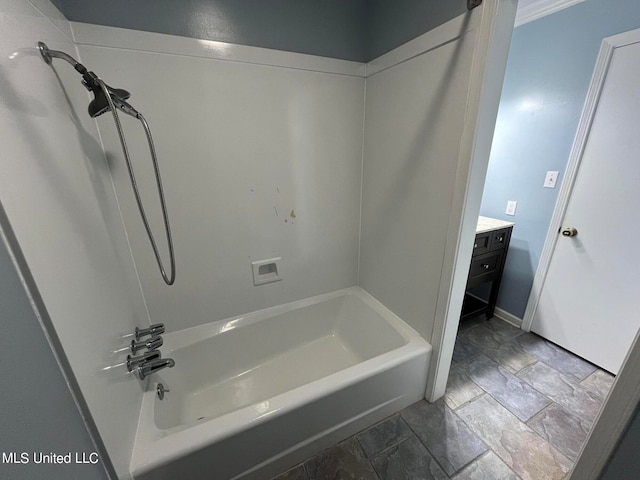 bathroom featuring vanity and bathing tub / shower combination