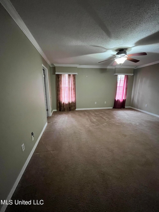 spare room featuring crown molding, a textured ceiling, carpet, and ceiling fan