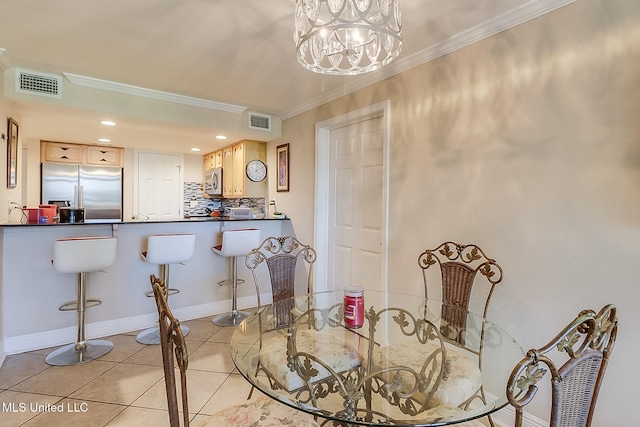 dining area featuring ornamental molding, tile patterned flooring, a chandelier, baseboards, and recessed lighting