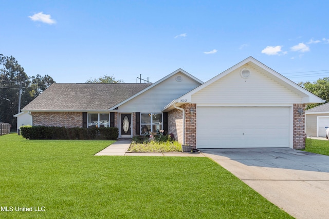 single story home with a front yard and a garage