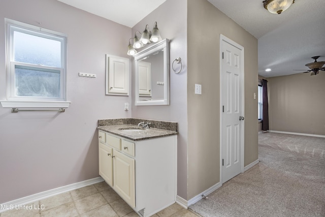 1602 Heather Ct, Ocean Springs, MS 39564 - bathroom featuring baseboards, ceiling fan, and vanity