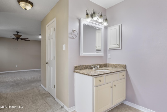 1602 Heather Ct, Ocean Springs, MS 39564 - bathroom with vanity, baseboards, and a ceiling fan