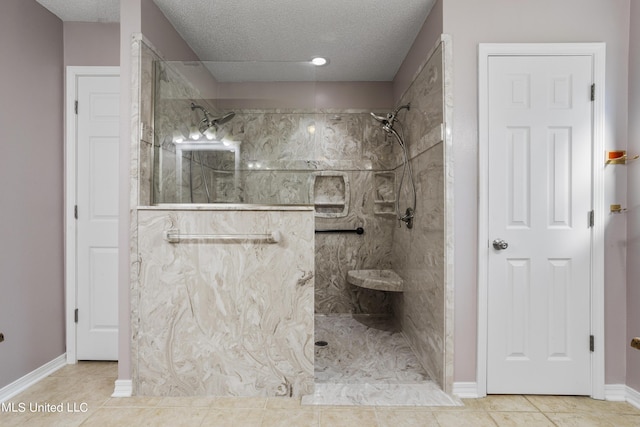 1602 Heather Ct, Ocean Springs, MS 39564 - bathroom with a walk in shower, a textured ceiling, and tile patterned flooring