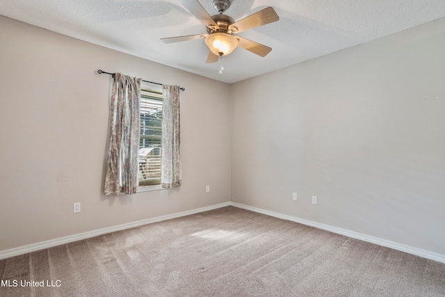 unfurnished room featuring a textured ceiling, carpet floors, and ceiling fan