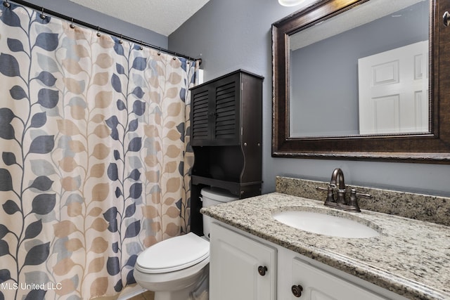 1602 Heather Ct, Ocean Springs, MS 39564 - full bath with toilet, a textured ceiling, a shower with curtain, and vanity