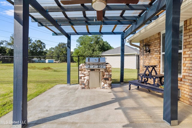 view of patio / terrace featuring exterior kitchen, area for grilling, and a pergola