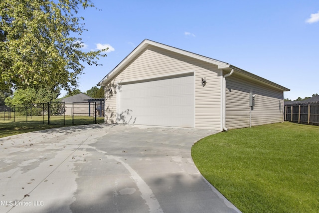 1602 Heather Ct, Ocean Springs, MS 39564 - view of home's exterior with a lawn, fence, an outdoor structure, and a garage