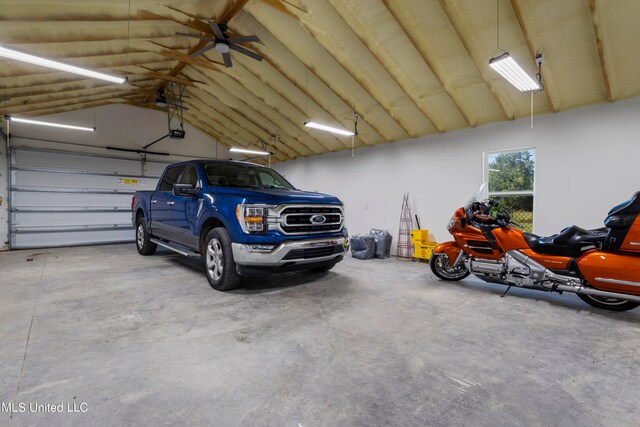 garage featuring a garage door opener and ceiling fan