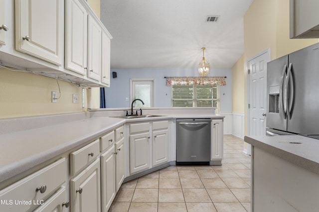 1602 Heather Ct, Ocean Springs, MS 39564 - kitchen featuring visible vents, a sink, light tile patterned floors, an inviting chandelier, and stainless steel appliances
