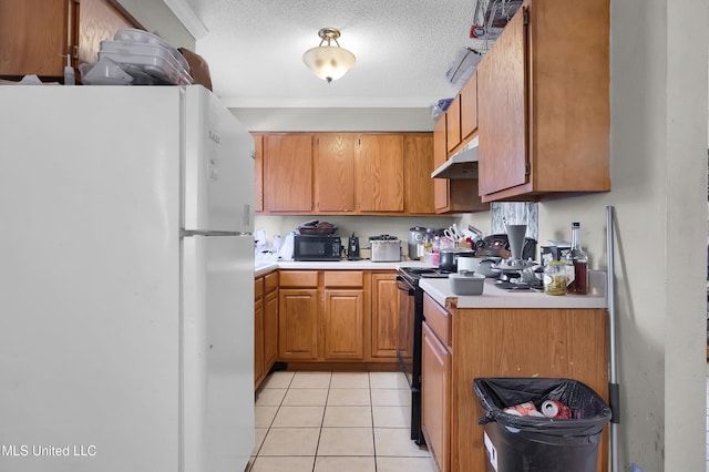 kitchen with light tile patterned flooring, a textured ceiling, and black appliances