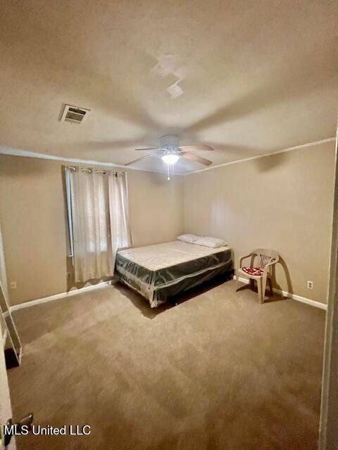 bedroom with ceiling fan, baseboards, visible vents, and carpet