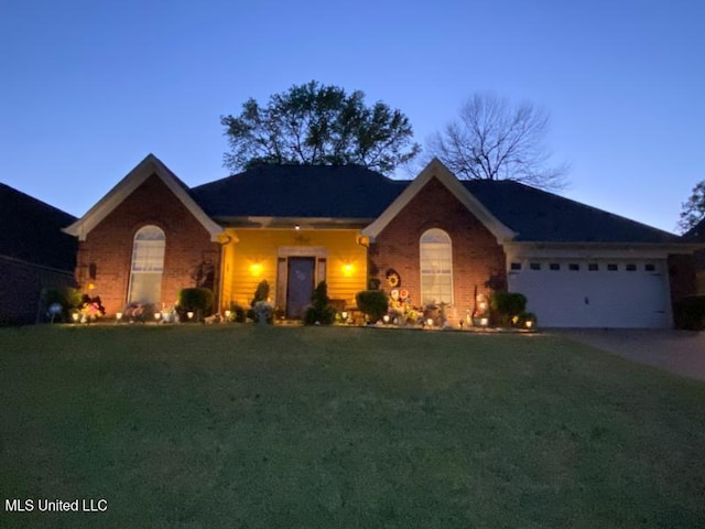 7741 Meadow Ridge Ln, Olive Branch, MS 38654 - ranch-style home featuring a front yard, brick siding, driveway, and a garage