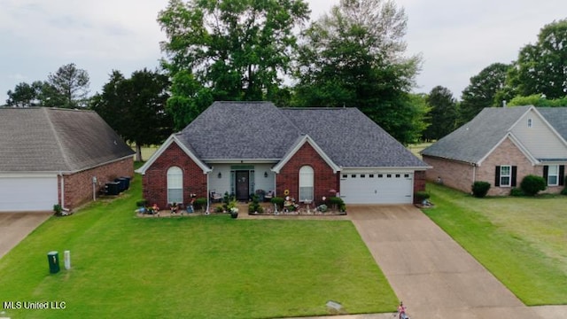 7741 Meadow Ridge Ln, Olive Branch, MS 38654 - traditional-style home featuring brick siding, driveway, a front lawn, and a garage