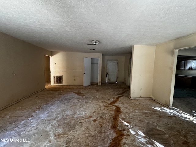 interior space featuring a textured ceiling