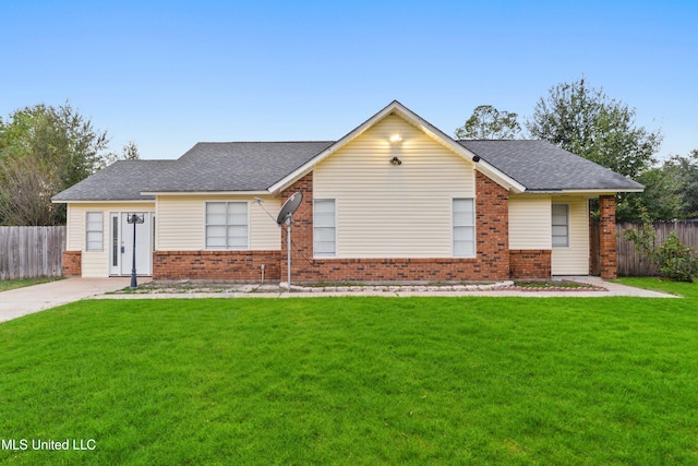 ranch-style home with a front yard