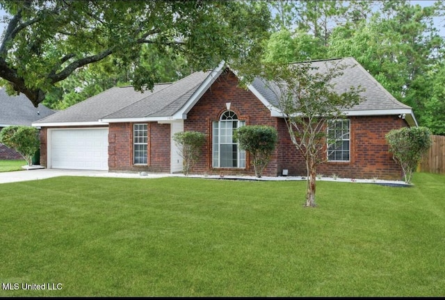 ranch-style house featuring a garage, driveway, brick siding, and a front yard