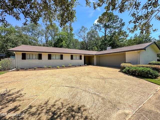 ranch-style home featuring a garage