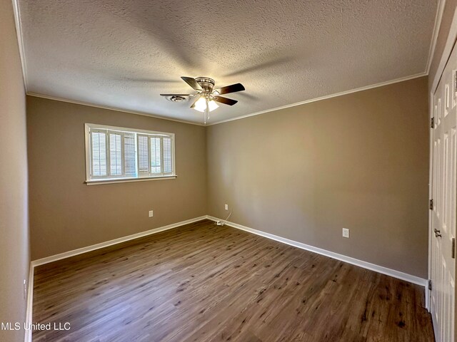 unfurnished room featuring crown molding, wood-type flooring, a textured ceiling, and ceiling fan