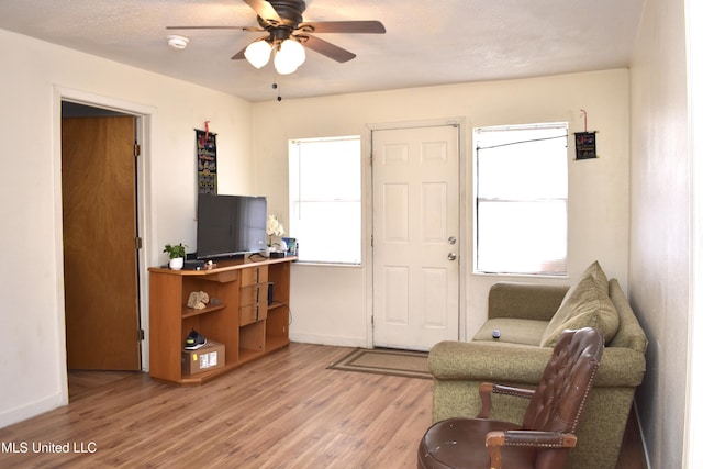 2201 15th Ave, Gulfport, MS 39501 - foyer featuring ceiling fan, light wood finished floors, and baseboards