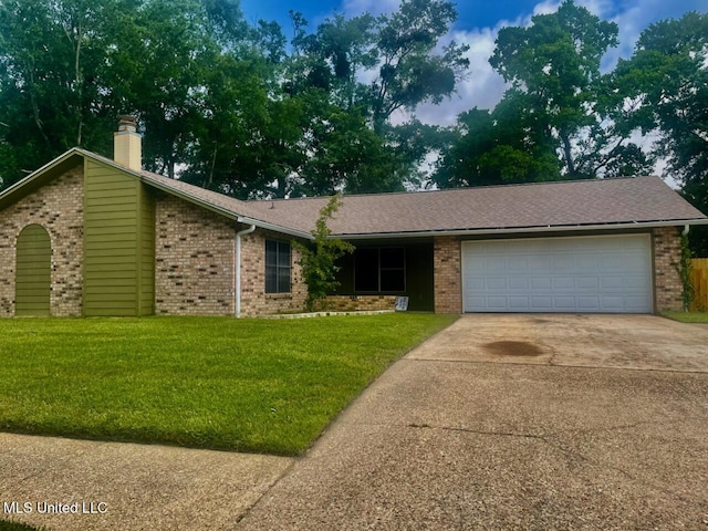 2909 Pimlico Dr, Ocean Springs, MS 39564 - view of front of house featuring brick siding, a garage, concrete driveway, and a front yard