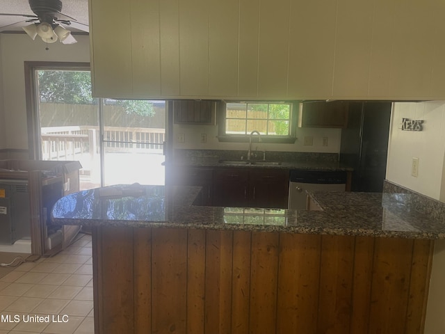 2909 Pimlico Dr, Ocean Springs, MS 39564 - kitchen with a sink, stainless steel dishwasher, dark stone countertops, and ceiling fan