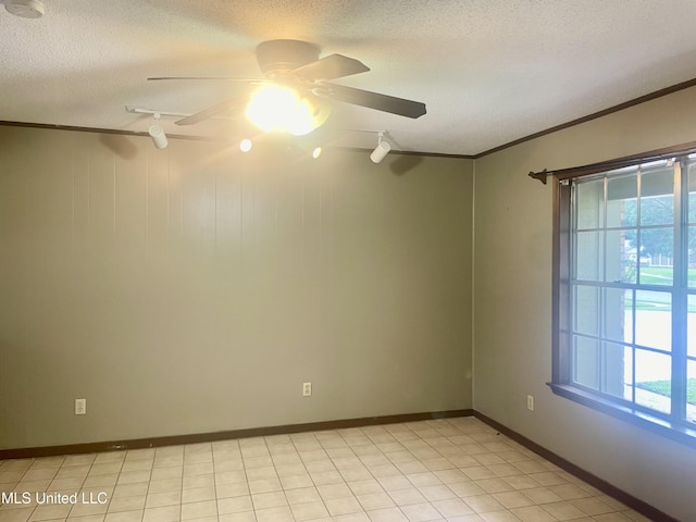 2909 Pimlico Dr, Ocean Springs, MS 39564 - empty room with healthy amount of natural light, ornamental molding, a ceiling fan, a textured ceiling, and baseboards