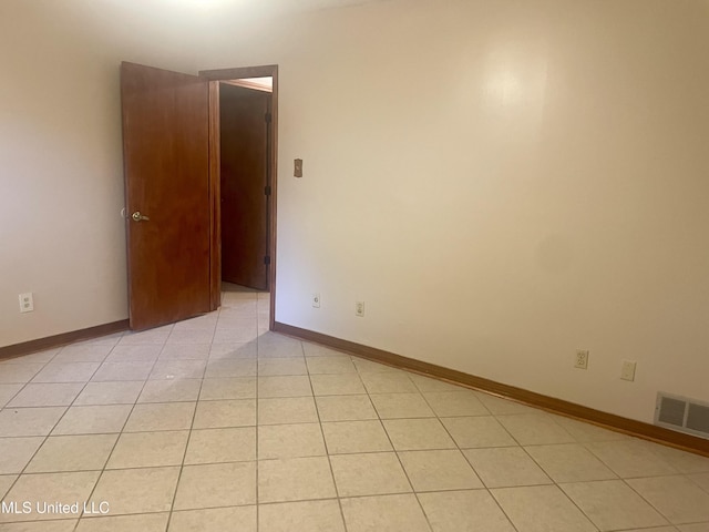 2909 Pimlico Dr, Ocean Springs, MS 39564 - spare room featuring light tile patterned floors and baseboards