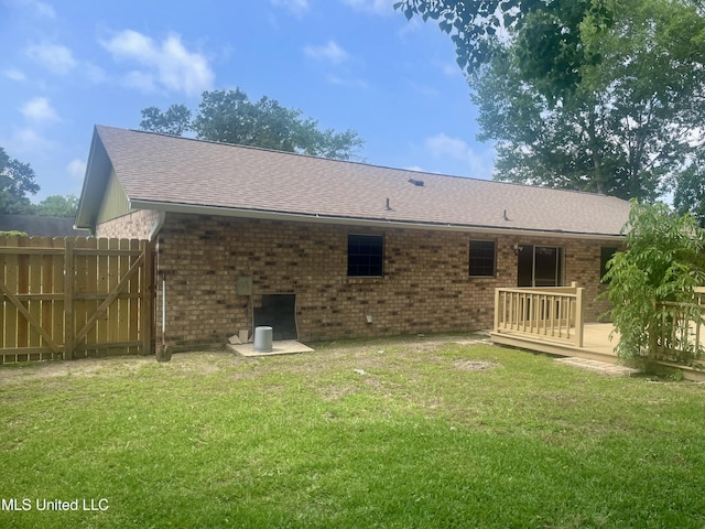 2909 Pimlico Dr, Ocean Springs, MS 39564 - rear view of house featuring a wooden deck, brick siding, and roof with shingles
