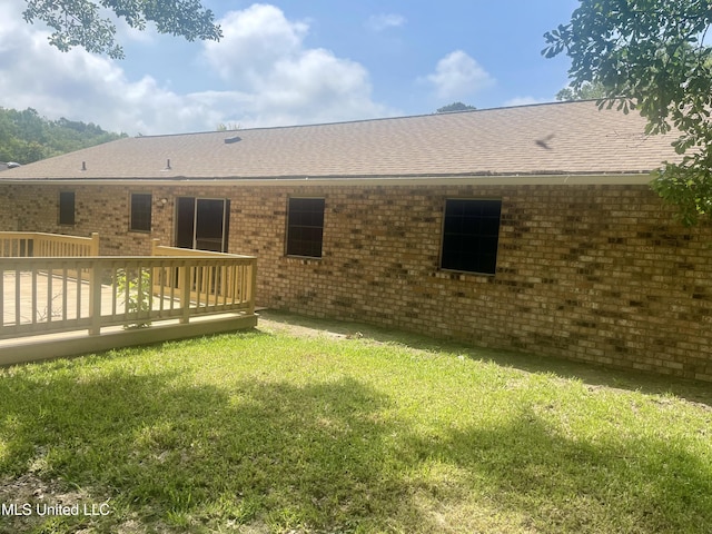 2909 Pimlico Dr, Ocean Springs, MS 39564 - rear view of house featuring a yard, roof with shingles, a deck, and brick siding