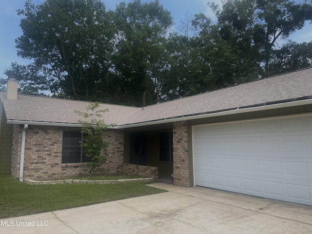 2909 Pimlico Dr, Ocean Springs, MS 39564 - ranch-style home featuring driveway, roof with shingles, brick siding, an attached garage, and a chimney