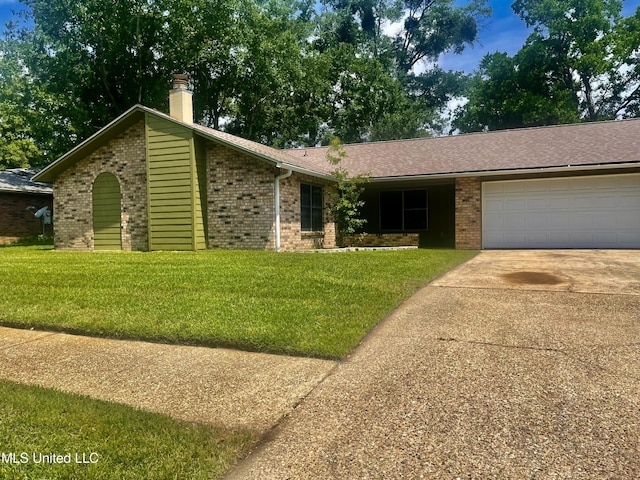 2909 Pimlico Dr, Ocean Springs, MS 39564 - view of front facade featuring a garage, brick siding, concrete driveway, and a front yard