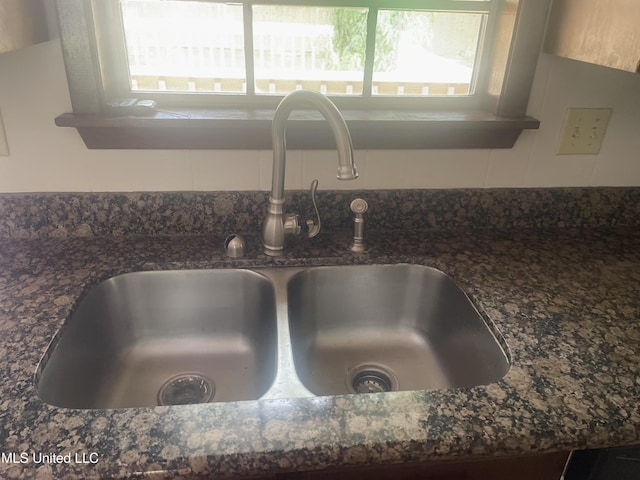 2909 Pimlico Dr, Ocean Springs, MS 39564 - kitchen view of a sink, tasteful backsplash, and dark stone counters