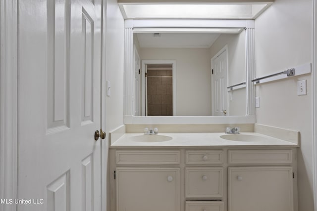 bathroom with double vanity and a sink