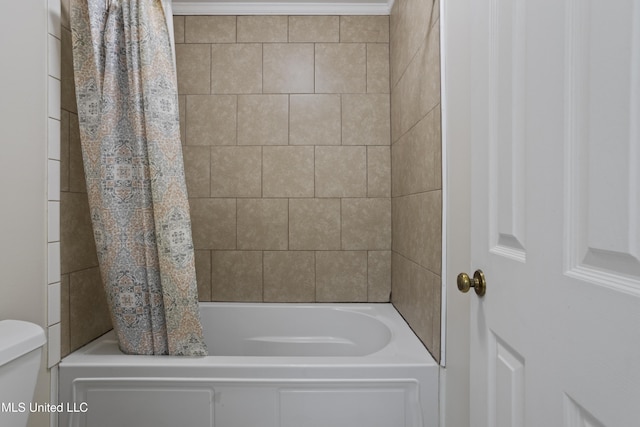 full bath with shower / bath combo with shower curtain and toilet