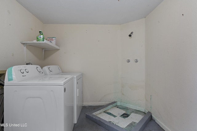 laundry area featuring washing machine and clothes dryer, laundry area, and baseboards