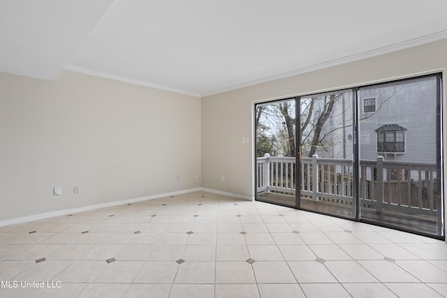 tiled empty room featuring baseboards and ornamental molding