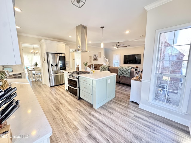 kitchen featuring a center island, hanging light fixtures, stainless steel appliances, island exhaust hood, and white cabinetry