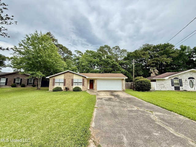 single story home with driveway, a garage, and brick siding
