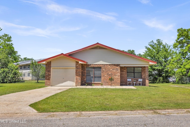 2309 Cottonwood Dr, Gulfport, MS 39503 - ranch-style home featuring brick siding, an attached garage, driveway, and a front yard