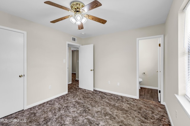 2309 Cottonwood Dr, Gulfport, MS 39503 - unfurnished bedroom with visible vents, baseboards, ceiling fan, connected bathroom, and carpet