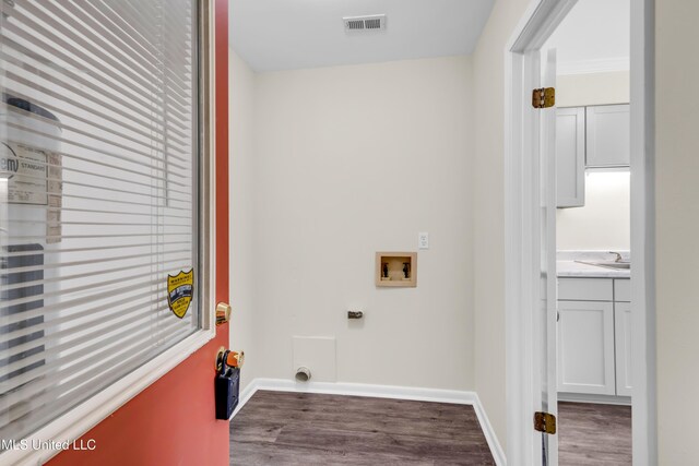 2309 Cottonwood Dr, Gulfport, MS 39503 - washroom with washer hookup, visible vents, wood finished floors, and laundry area