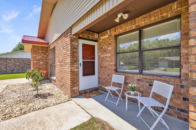 2309 Cottonwood Dr, Gulfport, MS 39503 - doorway to property featuring brick siding and a patio area