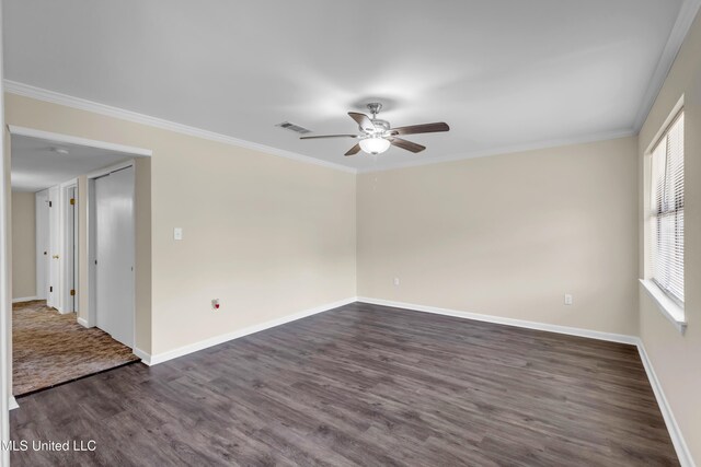 2309 Cottonwood Dr, Gulfport, MS 39503 - spare room with visible vents, crown molding, baseboards, dark wood-style floors, and a ceiling fan