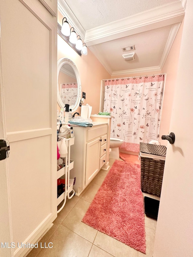 bathroom with a textured ceiling, vanity, crown molding, tile patterned flooring, and toilet